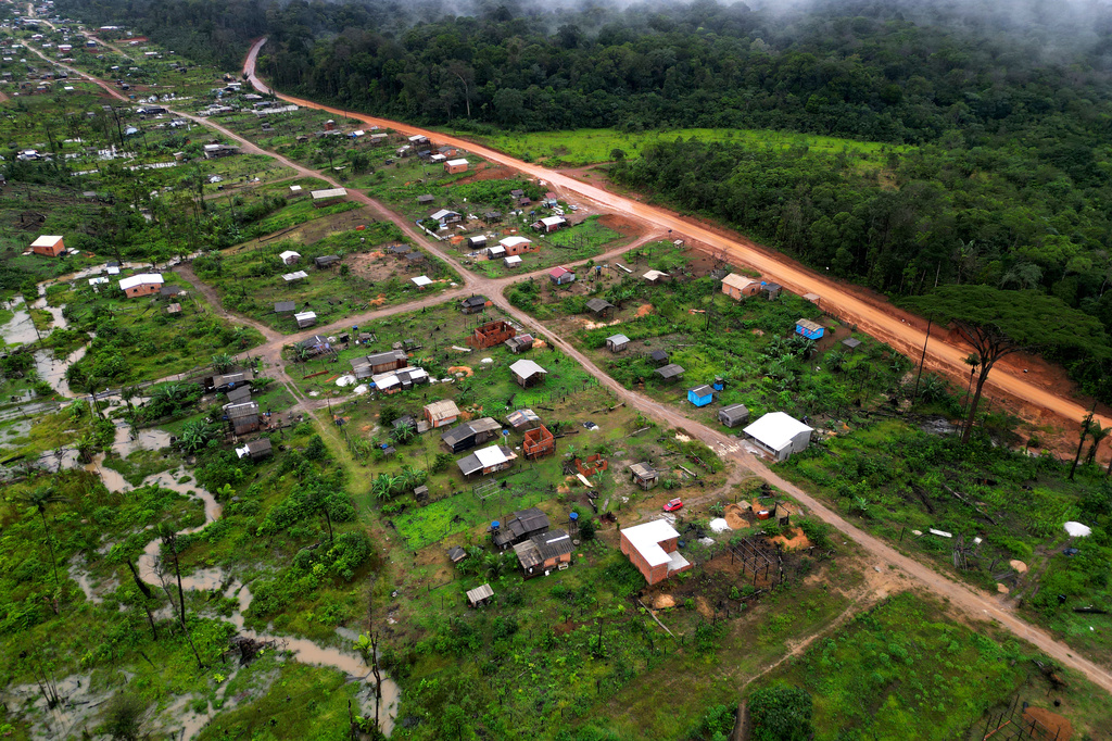 Trees line a cleared area known as Nova Conquista or New Conquest where families are building houses near the center of Oiapoque, Amapa state, Brazil, Wednesday, March 11, 2026. (AP Photo/Eraldo Peres)