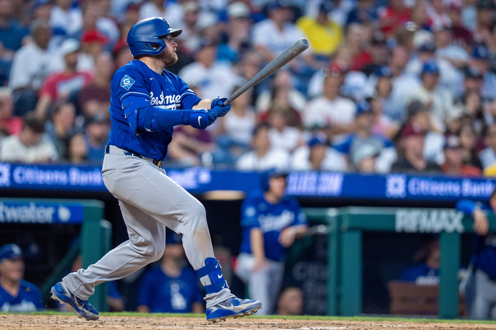 Los Angeles Dodgers' Max Muncy hits a two-run home run during the sixth inning of a baseball game against the Philadelphia Phillies, Wednesday, July 22, 2026, in Philadelphia. (AP Photo/Chris Szagola)