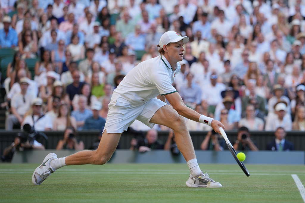 Jannik Sinner of Italy plays a return to Alexander Zverev of Germany during the men's singles final at Wimbledon Tennis Championships in London, Sunday, July 12, 2026. (AP Photo/Kin Cheung)