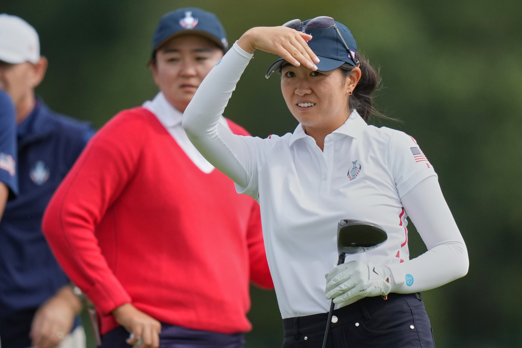 Rose Zhang, of the United States, right, watches her shot from the 2nd hole during a practice round for the Solheim Cup at the Bernardus Golf course in Vught, Netherlands, Tuesday, Sept. 8, 2026. (AP Photo/Alastair Grant)