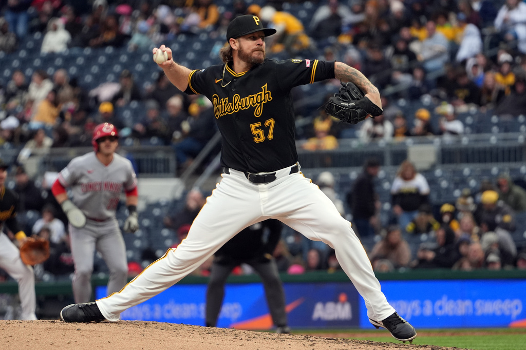 FILE - Pittsburgh Pirates pitcher Chris Devenski deliver a pitch against the Cincinnati Reds in the sixth inning of a baseball game in Pittsburgh, Saturday, May 2, 2026. (AP Photo/Tom E. Puskar, File)
