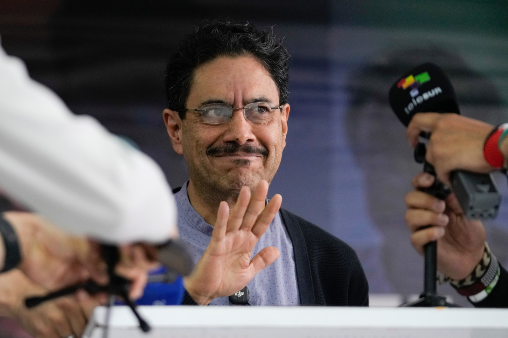 Presidential candidate Ivan Cepeda of the ruling Historic Pact coalition waves before a press conference in Bogota, Colombia, Monday, June 1, 2026, the day after the first round presidential election. (AP Photo/Matias Delacroix)