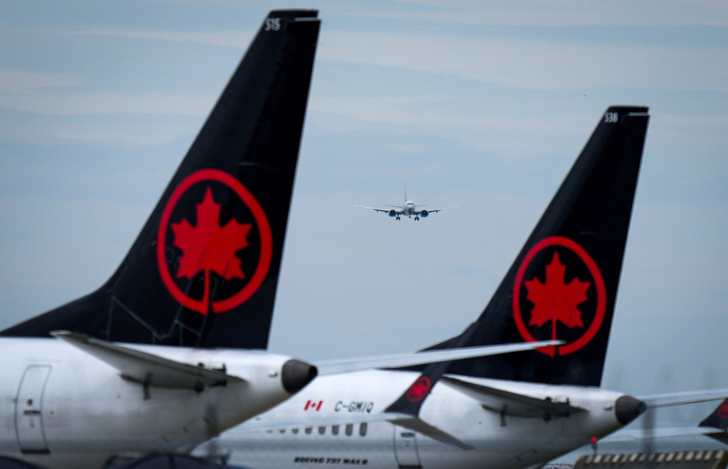 FILE - Air Canada aircraft sit parked at Vancouver International Airport in Richmond, British Columbia, Aug. 18, 2025. (Darryl Dyck/The Canadian Press via AP, file)