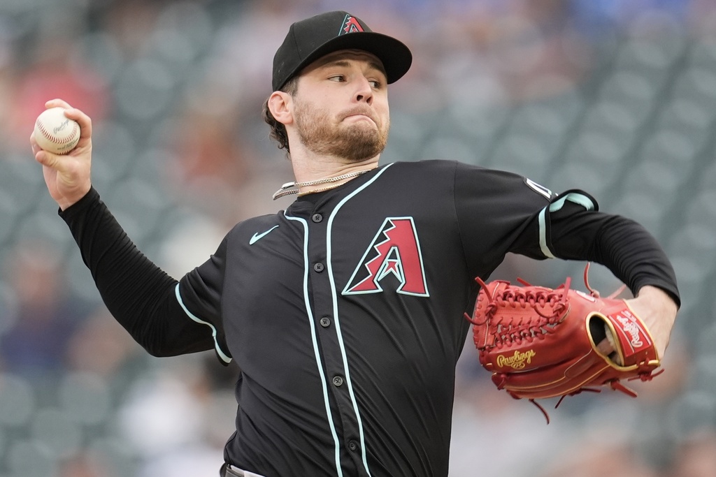 Arizona Diamondbacks pitcher Ryne Nelson (19) delivers against the Minnesota Twins in the first inning of a baseball game, Saturday, Sept. 13, 2025, in Minneapolis. (AP Photo/Mike Stewart)