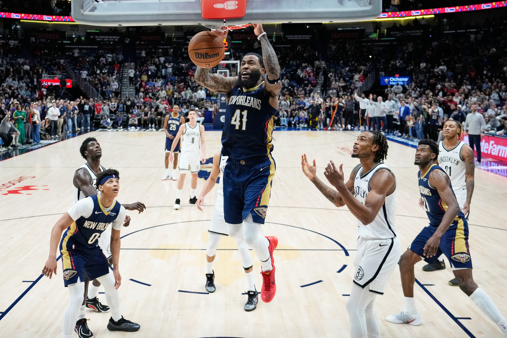 New Orleans Pelicans guard Saddiq Bey (41) slam dunks for the go-ahead basket in the final minute of the second half of an NBA basketball game against the Brooklyn Nets, Wednesday, Jan. 14, 2026, in New Orleans. (AP Photo/Gerald Herbert)