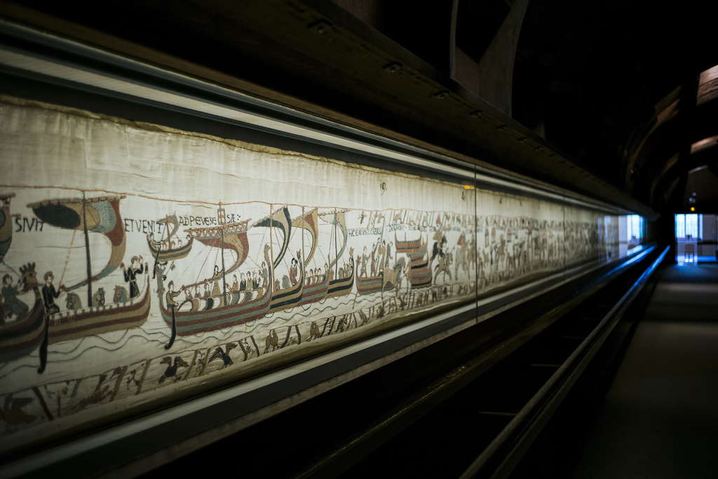 FILE - This photo taken Wednesday, Sept. 18, 2019 shows the 11th century Bayeux tapestry chronicling the Norman conquest of England, in Bayeux, Normandy, France. (AP Photo/Kamil Zihnioglu, File)