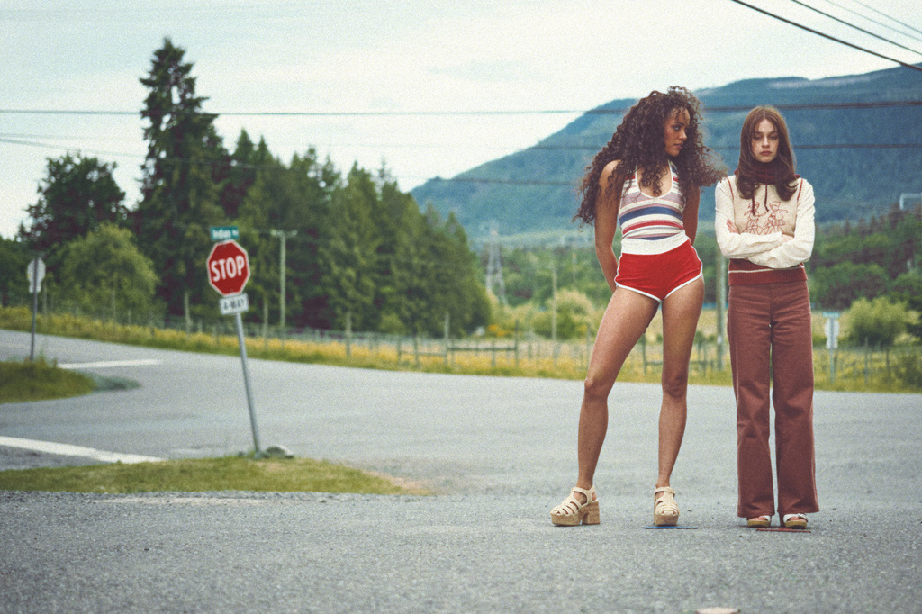 This image released by Mubi shows Quintessa Swindell, left, and Amanda Fix in a scene from "Teenage Sex and Death at Camp Miasma." (Ryan Plummer/Mubi via AP)