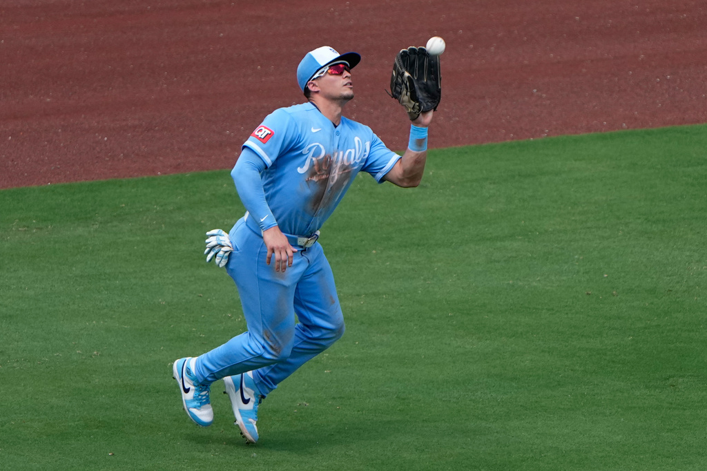Kansas City Royals left fielder Isaac Collins catches a fly ball for the out on Philadelphia Phillies' Garrett Stubbs during the fifth inning of a baseball game Sunday, July 5, 2026, in Kansas City, Mo. (AP Photo/Charlie Riedel)