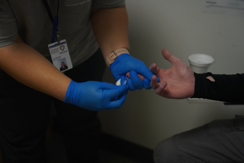 A participant in the syringe exchange program receives a blood draw during a visit at the Clark County Health Department Tuesday, Nov. 23, 2025, in Jeffersonville, Ind. (AP Photo/Obed Lamy)
