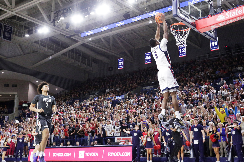 Gonzaga forward Emmanuel Innocenti (5) goes up for a dunk during the second half of an NCAA college basketball game against Washington State, Tuesday, Feb. 10, 2026, in Spokane, Wash. (AP Photo/Young Kwak)