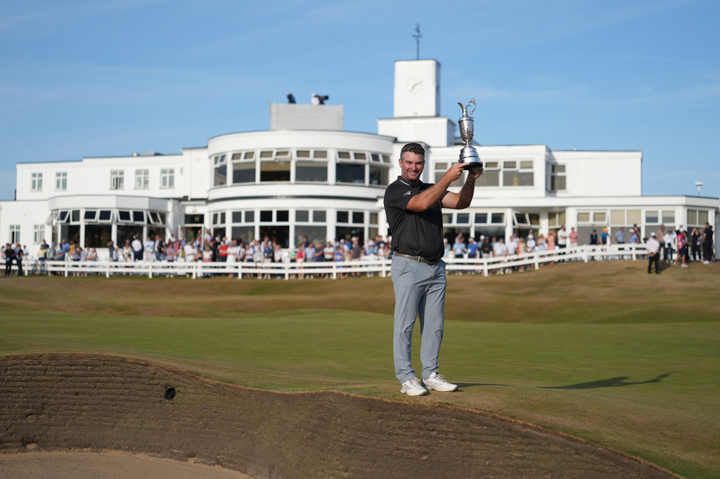 Ryan Fox of New Zealand poses with the Claret Jug trophy in front of the club house, after winning the British Open Golf championships at Royal Birkdale golf club, in Southport, England, Sunday, July 19, 2026. (AP Photo/Jon Super)