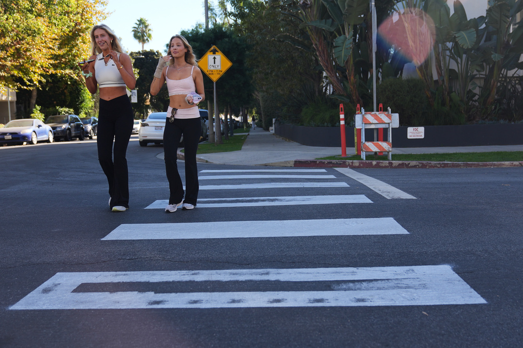 Crosswalks painted by activists are shown at the intersection of Wilkins Ave. and Kelton Ave. in the Westwood section of Los Angeles Tuesday, Dec. 9, 2025, in Los Angeles. (AP Photo/Marcio Jose Sanchez)