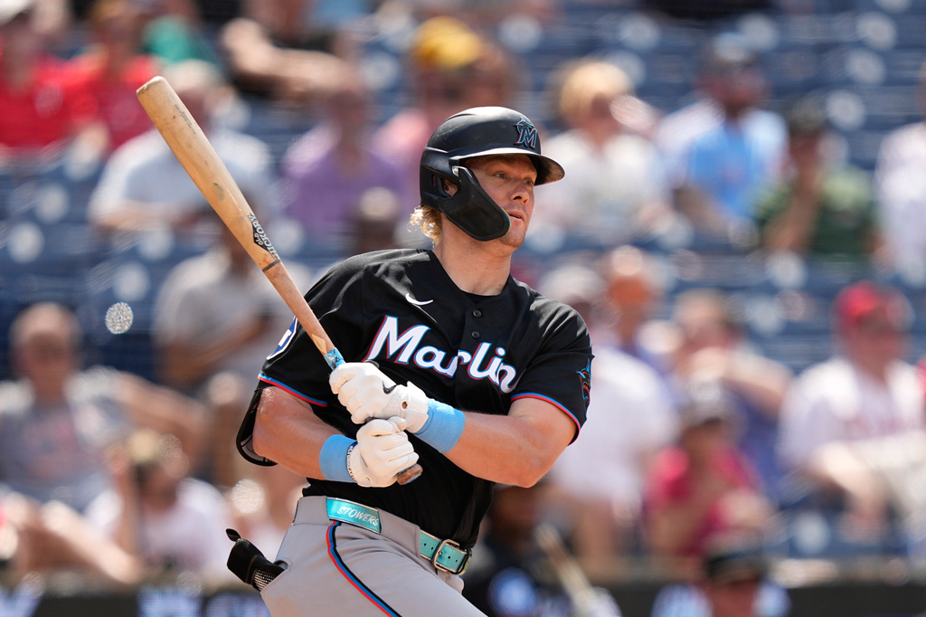 Miami Marlins' Kyle Stowers follows through after hitting a run-scoring single against Philadelphia Phillies pitcher Orion Kerkering during the eighth inning of a baseball game Wednesday, June 17, 2026, in Philadelphia. (AP Photo/Matt Slocum)