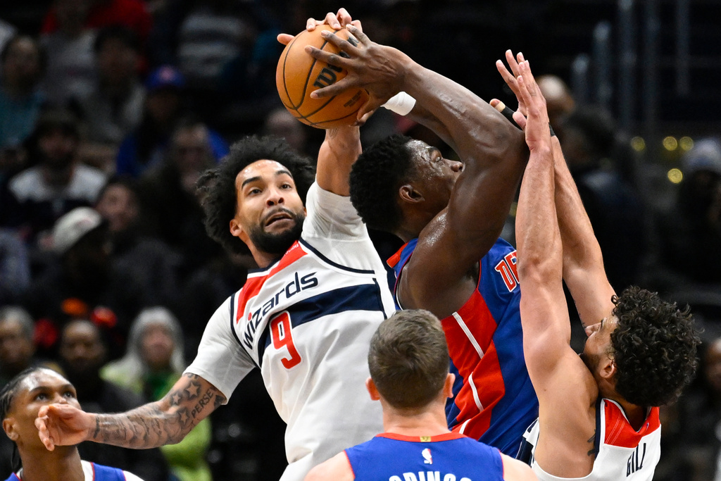 Washington Wizards forward Justin Champagnie (9) blocks the shot of Detroit Pistons center Jalen Duren during the first half of an NBA basketball game, Tuesday, March 17, 2026, in Washington. (AP Photo/John McDonnell)
