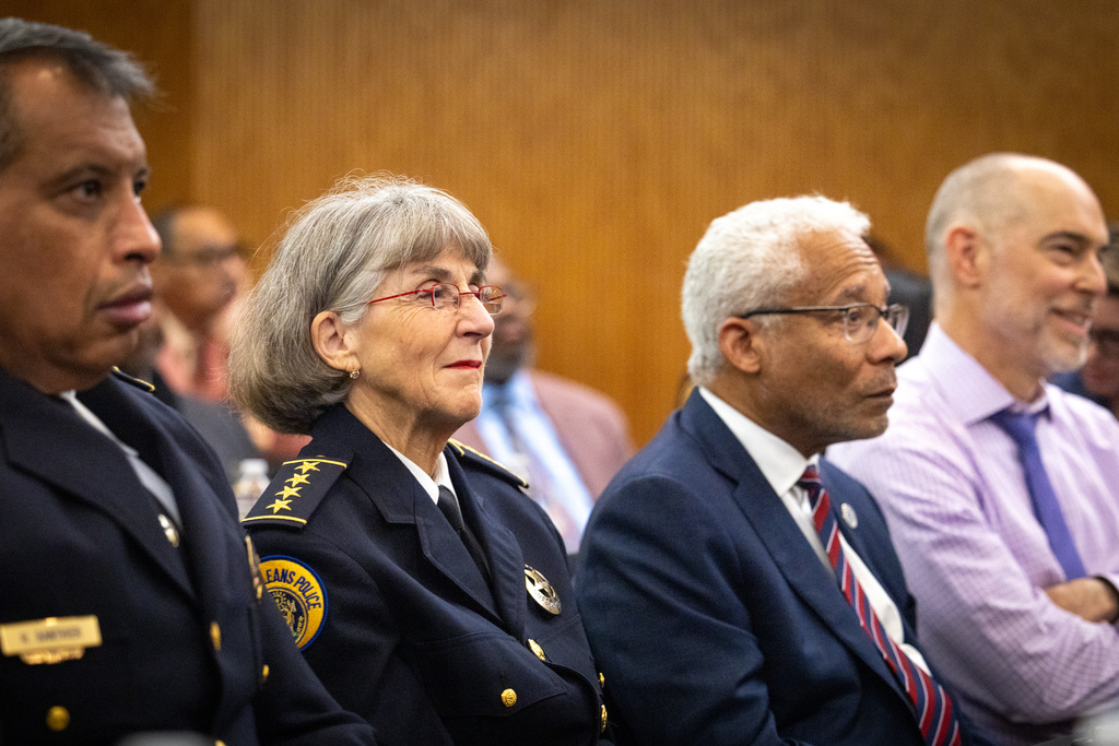 New Orleans Police Superintendent Anne Kirkpatrick, second from left, listens during a gathering marking the end of the New Orleans Police Department consent decree, Wednesday, Nov. 19, 2025 at Loyola University Law School in New Orleans. (Brett Duke/The Times-Picayune/The New Orleans Advocate via AP)
