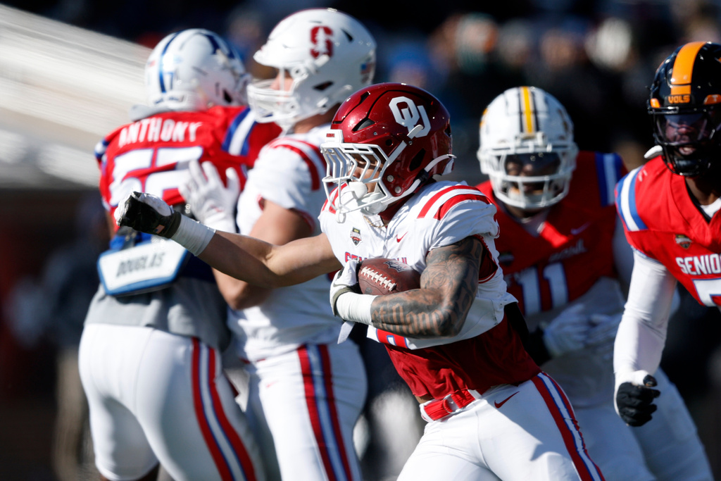 American Team running back Jaydn Ott (8), of Oklahoma, carries the ball during the first half of the Senior Bowl NCAA college football game Saturday, Jan. 31, 2026, in Mobile, Ala. (AP Photo/Butch Dill)