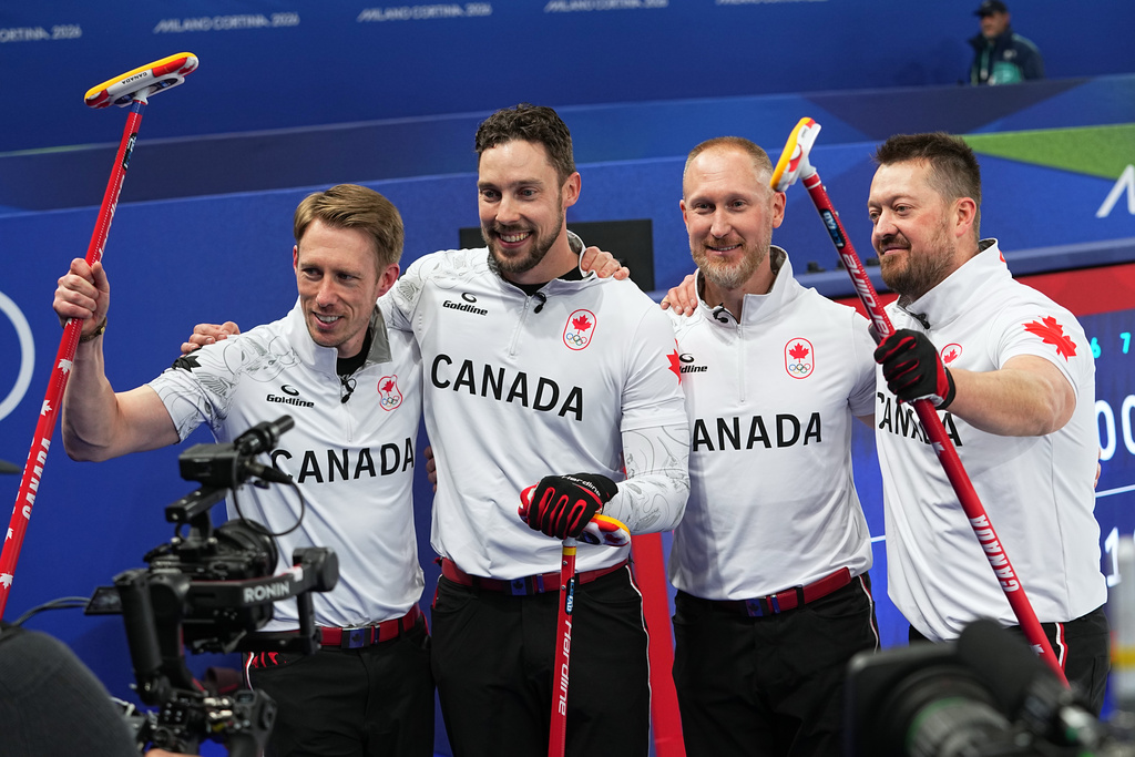 Canada's Brett Gallant, Brad Jacobs, Marc Kennedy, Ben Hebert celebrate defeating Norway in a men's curling semifinal match at the 2026 Winter Olympics, in Cortina d'Ampezzo, Italy, Thursday, Feb. 19, 2026. (AP Photo/Fatima Shbair)