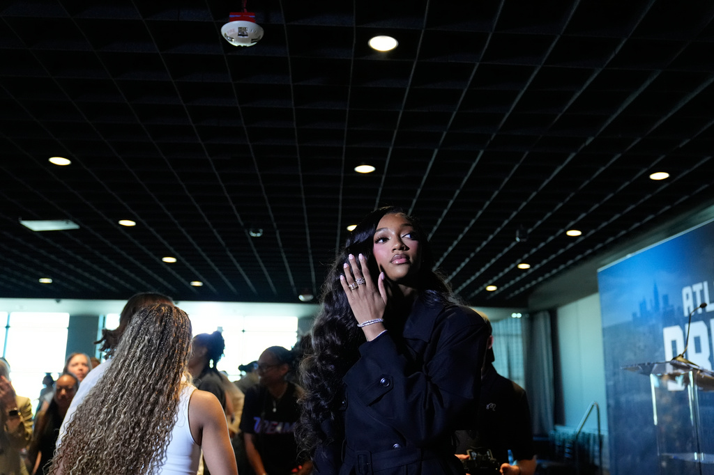 Angel Reese is introduced by the Atlanta Dream on Friday, April 17, 2026, in Atlanta. The Dream acquired Reese for first-round draft picks in 2027 and 2028. (AP Photo/Brynn Anderson)