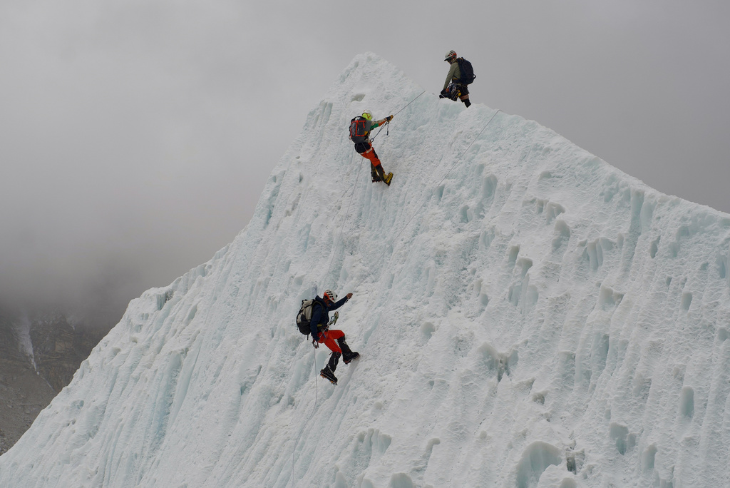 Mountaineers participate in a training session at the Khumbu Icefall as they prepare for their ascent to the summit of Mount Everest, Nepal, Saturday, May 2, 2026. (AP Photo/Pasang Rinzee Sherpa)