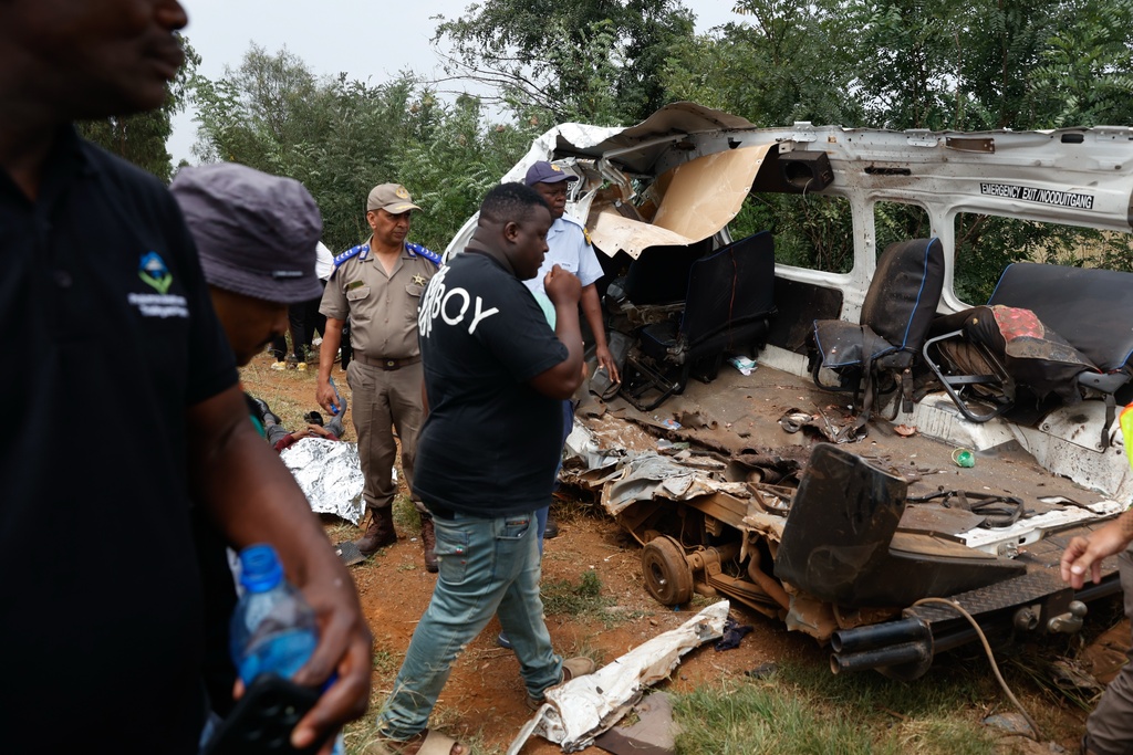 Police inspects the scene of a collision between a truck and a minibus carrying school children in Vanderbijlpark, South of Johannesburg, South Africa, Monday, Jan. 19, 2026. (AP Photo)