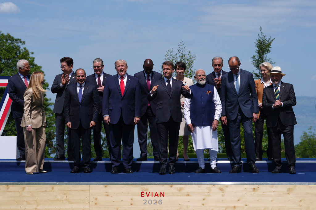French President Emmanuel Macron, center, poses with leaders during a group photo of G7 leaders and invited nations during the G7 summit in Evian-les-Bains, France, Tuesday, June 16, 2026. (AP Photo/Thibault Camus)