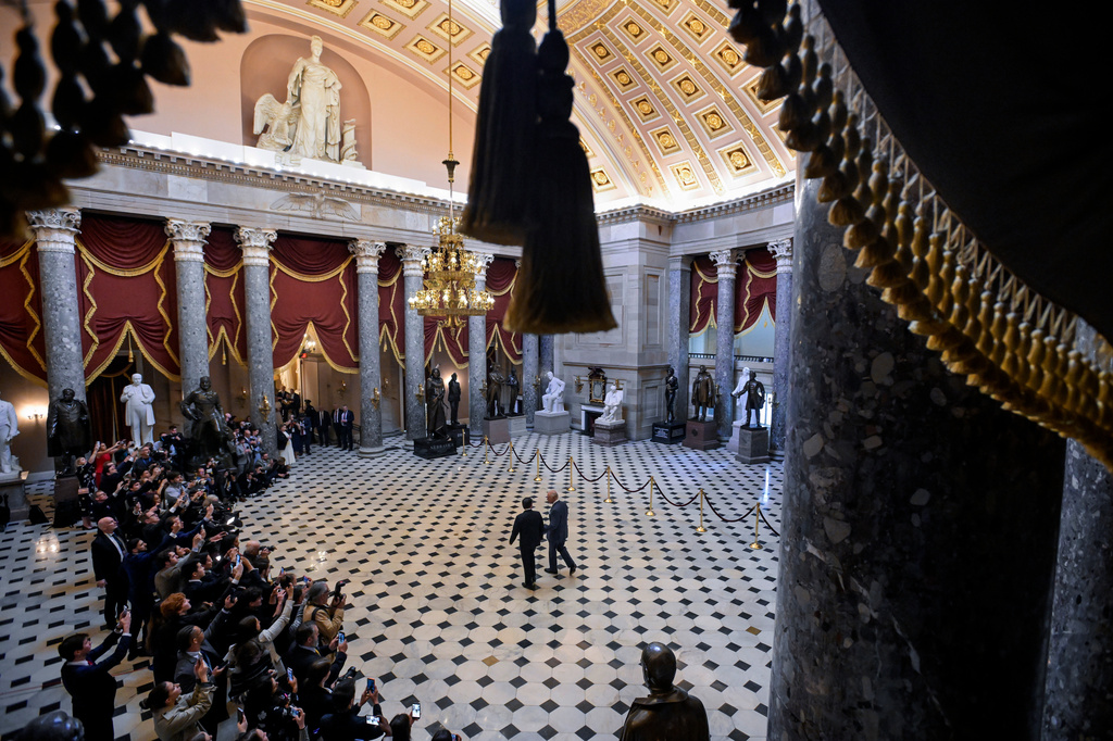 Speaker of the House Mike Johnson, R-La., left and Britain's King Charles III walk through Statuary Hall, en route to King Charles III's address to a joint meeting of Congress in the House Chamber at the U.S. Capitol, Tuesday, April 28, 2026, in Washington. (AP Photo/Rod Lamkey, Jr.)