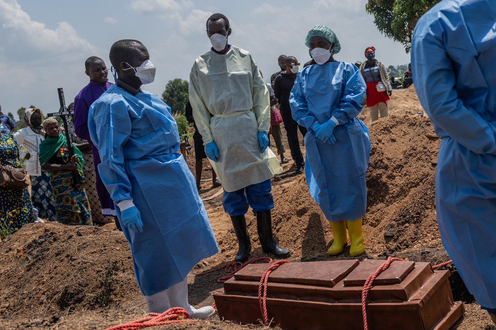 Red Cross workers prepare to bury Vanisa Anifa, a 6-month-old orphaned girl who died of Ebola, at the Bigo Cemetery, in Bunia, Congo, Friday, June 19, 2026. (AP Photo/Moses Sawasawa)