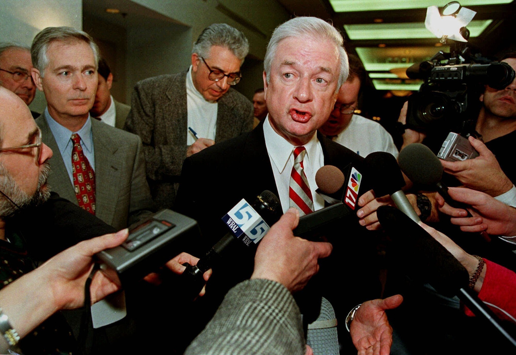 FILE - North Carolina Gov. Jim Hunt responds to reporters' questions at a hotel, in Durham, N.C., Jan. 20, 1999. (AP Photo/Bob Jordan, File)