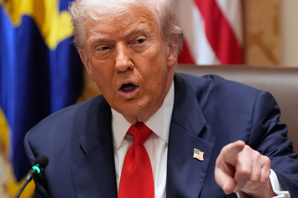 President Donald Trump speaks during a meeting with Argentina's President Javier Milei in the Cabinet Room of the White House, Tuesday, Oct. 14, 2025, in Washington. (AP Photo/Alex Brandon)