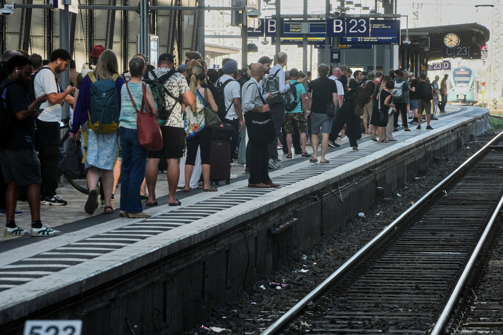 Passengers wait for a train at a platform in the central train station in Frankfurt, Germany, Wednesday, June 24, 2026, following the nationwide service disruption on the Deutsche Bahn network. (AP Photo/Michael Probst)