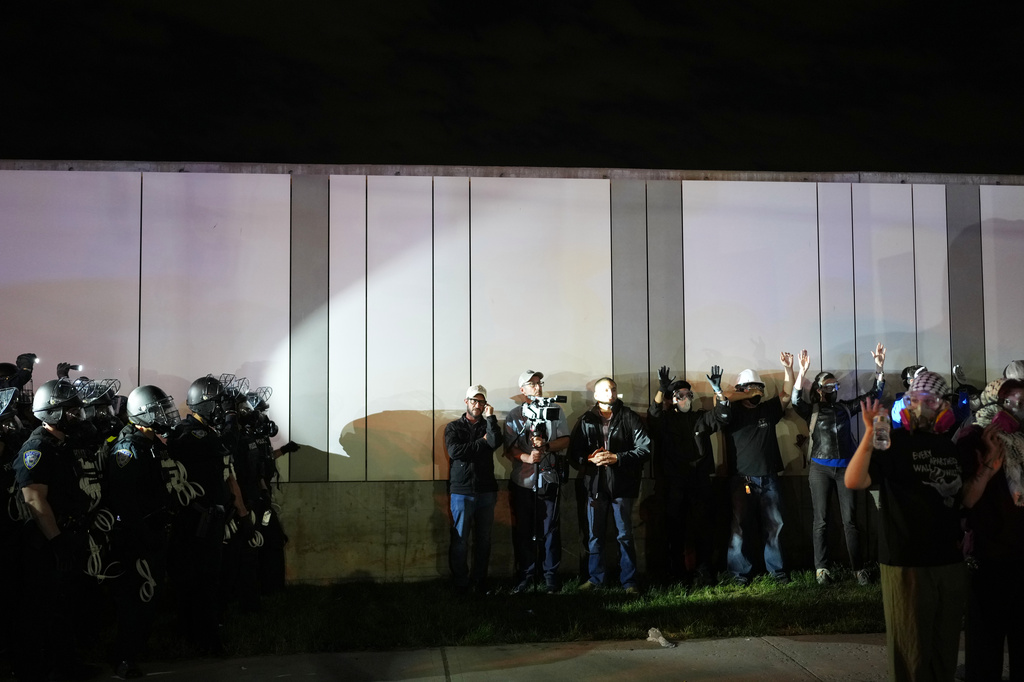 FILE - Law enforcement officers kettle protesters outside Delaney Hall detention center Sunday, May 31, 2026, in Newark, N.J. (AP Photo/Adam Gray, File)