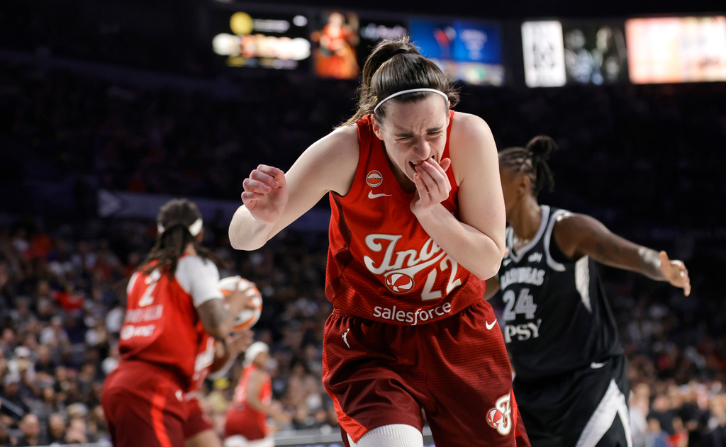 Indiana Fever guard Caitlin Clark (22) reacts after being hurt on a play during the second half in Game 3 of an WNBA basketball first-round playoff series against the Las Vegas Aces, Thursday, Oct. 1, 2026, in Las Vegas. (AP Photo/Steve Marcus)