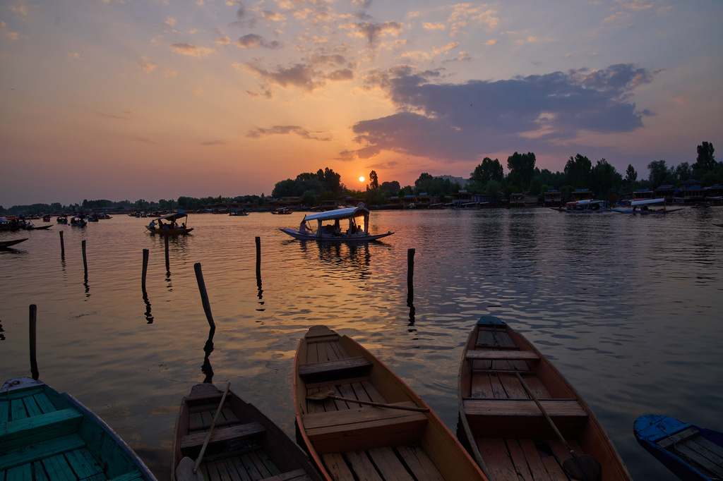 Tourists enjoy a ride on a traditional boat at sunset on Dal Lake in Srinagar, Indian controlled Kashmir, Monday, June 1, 2026. (AP Photo/Dar Yasin)