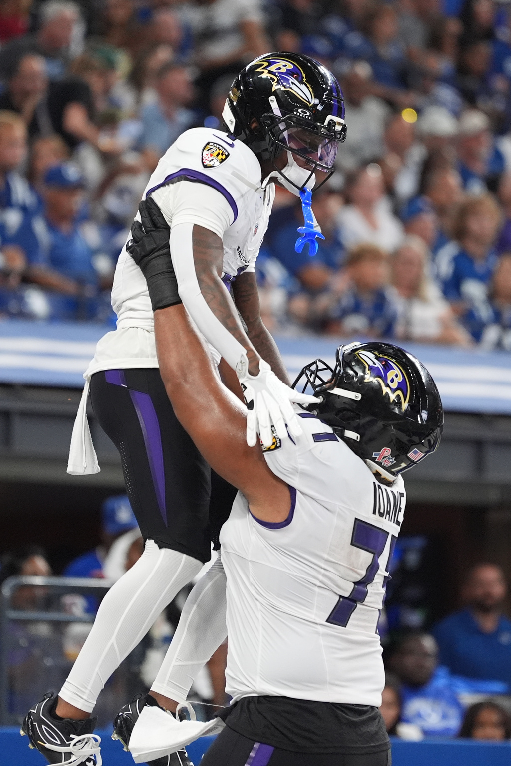 Baltimore Ravens' Zay Flowers celebrates his touchdown with Olaivavega Ioane during the first half of an NFL football game against the Indianapolis Colts Sunday, Sept. 13, 2026, in Indianapolis. (AP Photo/Jeff Roberson)