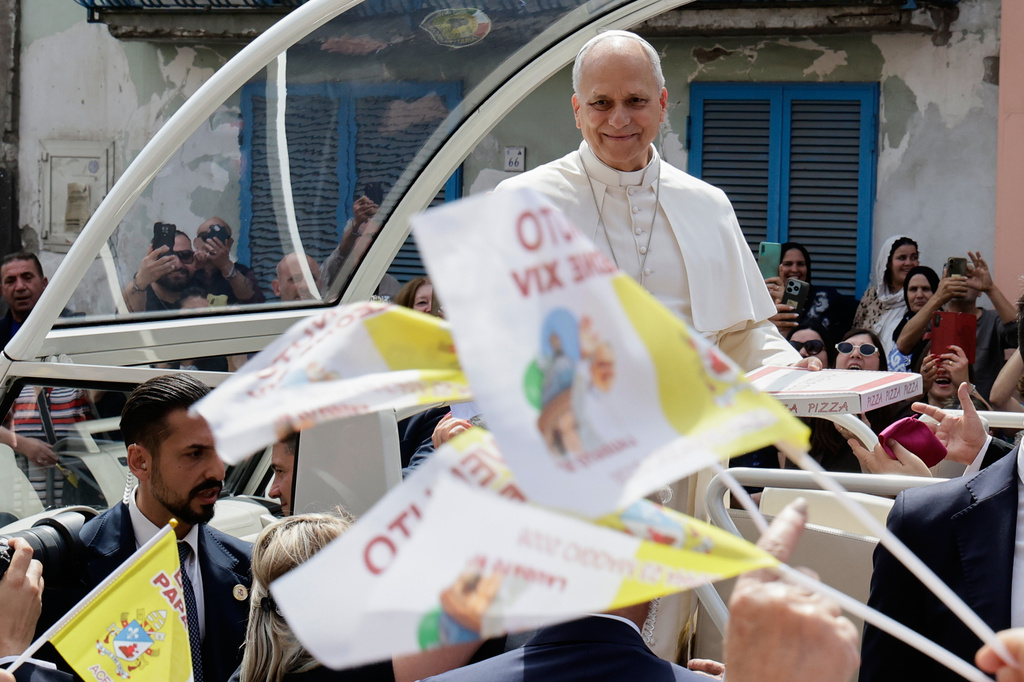 Pope Leo XIV rides on his popemobile during his one-day pastoral visit in Acerra, Italy, Saturday, May 23, 2026. (AP Photo/Salvatore Laporta)