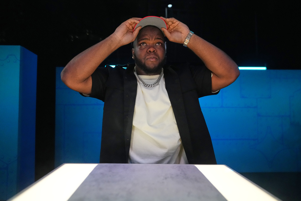Ohio State defensive lineman Kayden McDonald puts on a hat after being chosen by the Houston Texans with the 36th overall pick during the second round of the NFL football draft, Friday, April 24, 2026, in Pittsburgh. (AP Photo/Jeff Roberson)