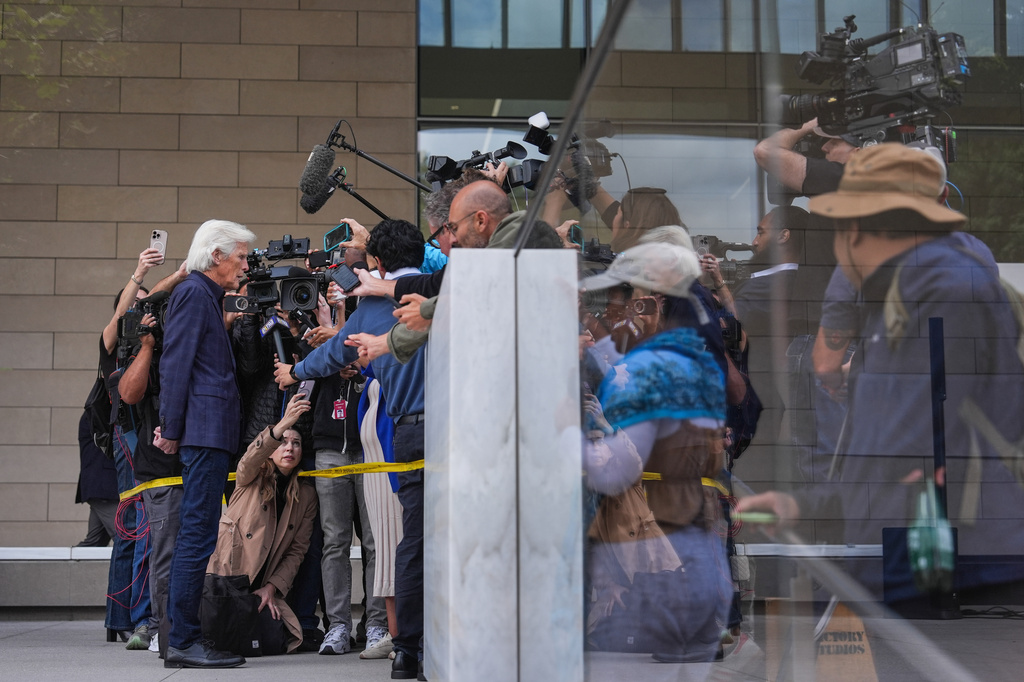 Matthew Perry's stepfather, Keith Morrison, left, talks to reporters after the sentencing of Kenneth Iwamasa, one of five people who pleaded guilty in connection with the ketamine overdose death of the actor, in Los Angeles, Wednesday, May 27, 2026. (AP Photo/Jae C. Hong)