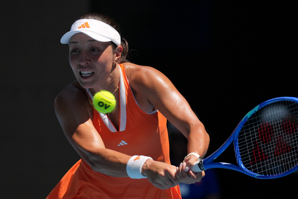 Jessica Pegula of the U.S. plays a backhand return to her compatriot Madison Keys during their fourth round match at the Australian Open tennis championship in Melbourne, Australia, Monday, Jan. 26, 2026. (AP Photo/Mark Baker)