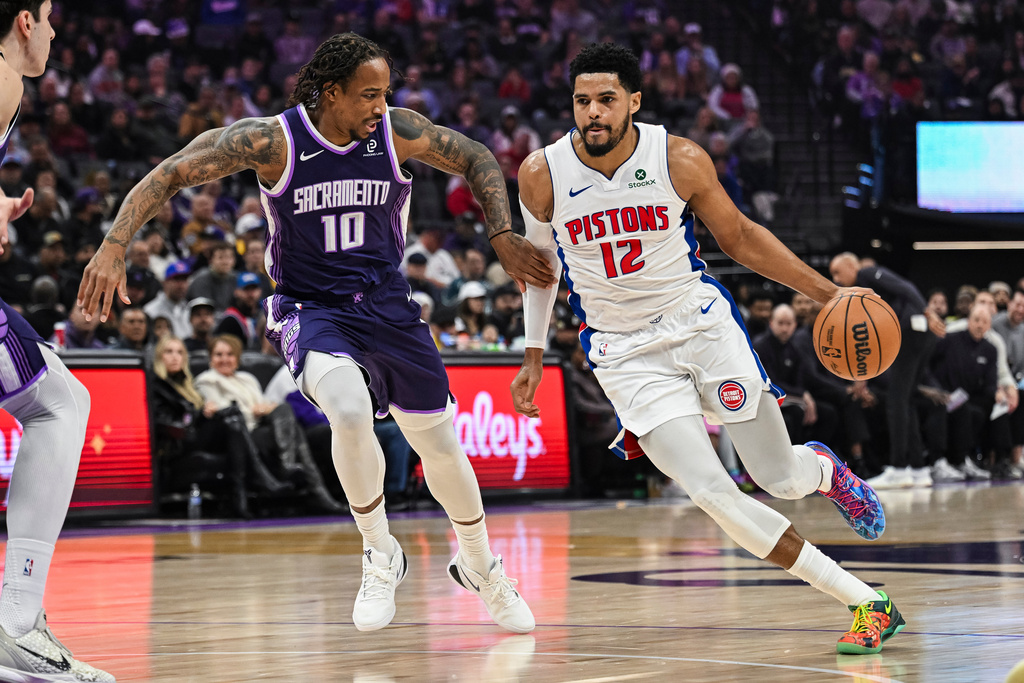 Detroit Pistons forward Tobias Harris (12) ,right, dribbles past Sacramento Kings guard Demar Derozan (10) ,left, during the first half of an NBA basketball game, Tuesday, Dec. 23, 2025, in Sacramento, Calif. (AP Photo/Justine Willard)