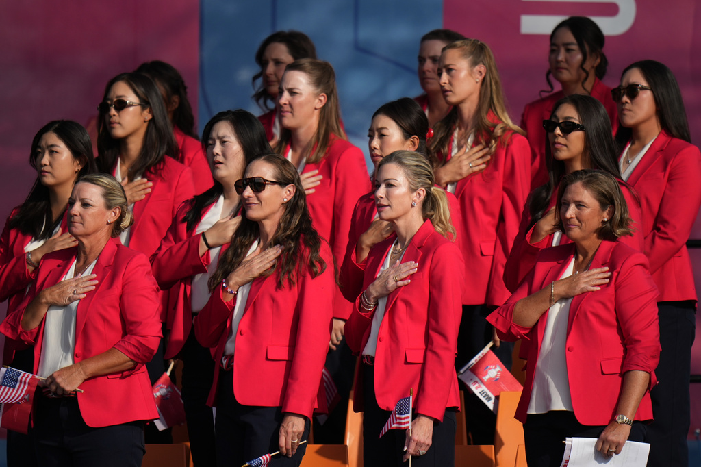 United States players stand for the national anthem during the opening ceremony for the Solheim Cup golf tournament in Vught, Netherlands ,Thursday, Sept. 10, 2026, . (AP Photo/Alastair Grant)