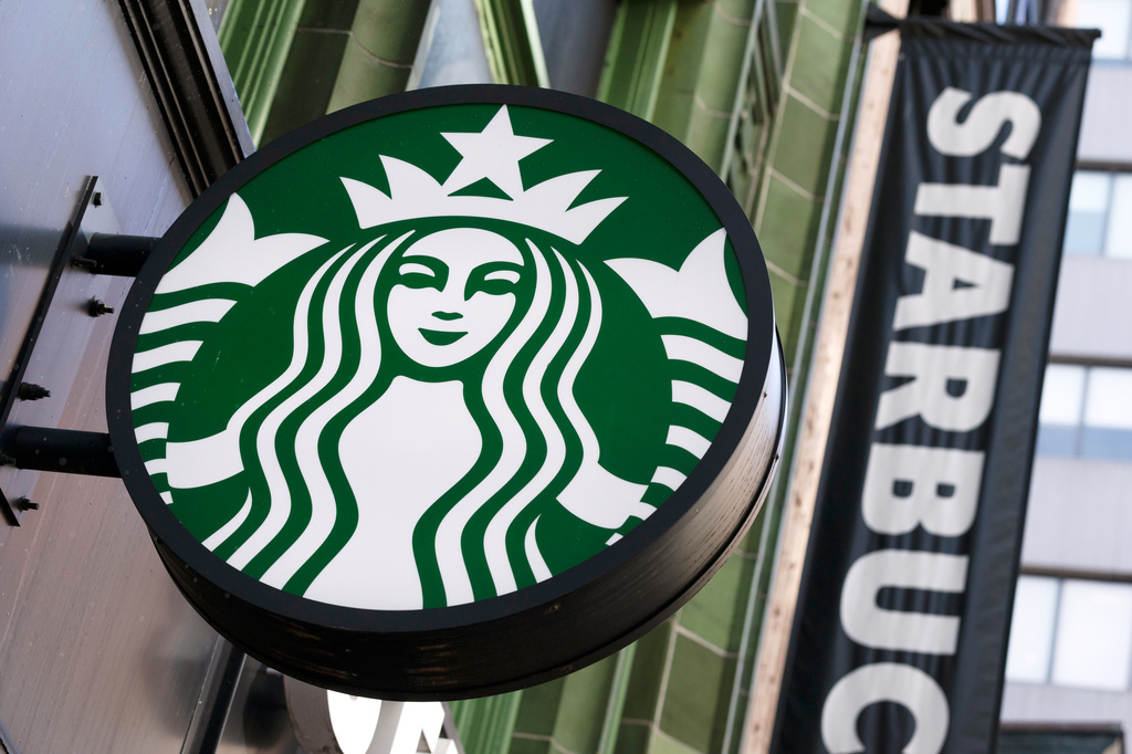 FILE - The Starbucks logo is seen on a storefront, Oct. 14, 2022, in Boston. (AP Photo/Michael Dwyer, File)