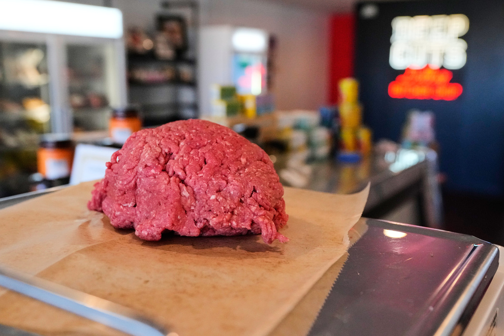 An order of ground beef is prepared for a customer at Deep Cuts butcher shop, Tuesday, Oct. 21, 2025, in Dallas. (AP Photo/Tony Gutierrez)