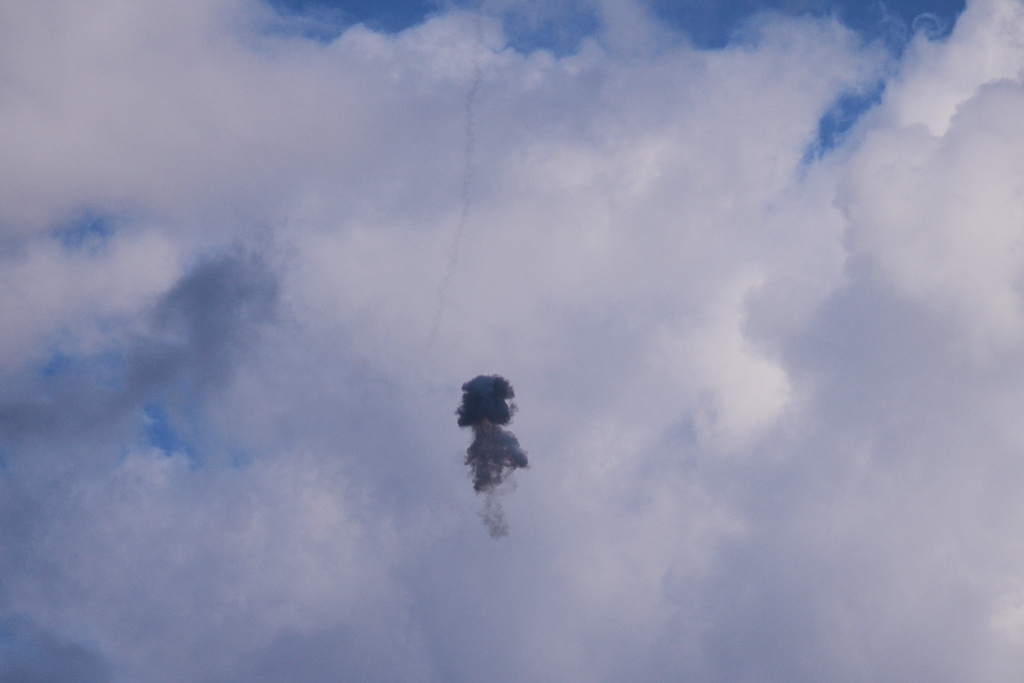 Smoke and explosion following an Israeli air defense interception over Kiryat Shmona, northern Israel, on the border with Lebanon, Monday, March 16, 2026. (AP Photo/Ariel Schalit)