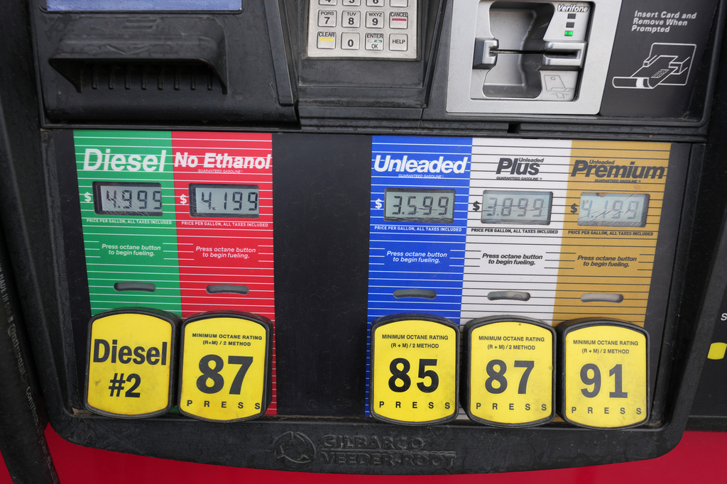 The prices for the grades of gasoline available are electronically displayed on the pump at a QuikTrip gasoline station Sunday, April 12, 2026 in Greenwood Village, Colo. (AP Photo/David Zalubowski)