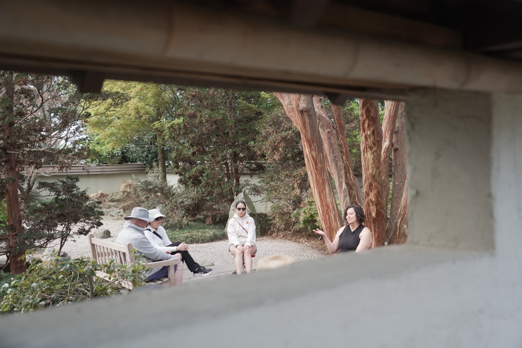 CORRECTS SPELLING TO JC Forest therapy guide Shawn Ramsey, far right, leads a "forest bathing" session in a walled Japanese garden at the JC Raulston Arboretum in Raleigh, N.C., on Sunday, March 22, 2026. (AP Photo/Allen G. Breed)