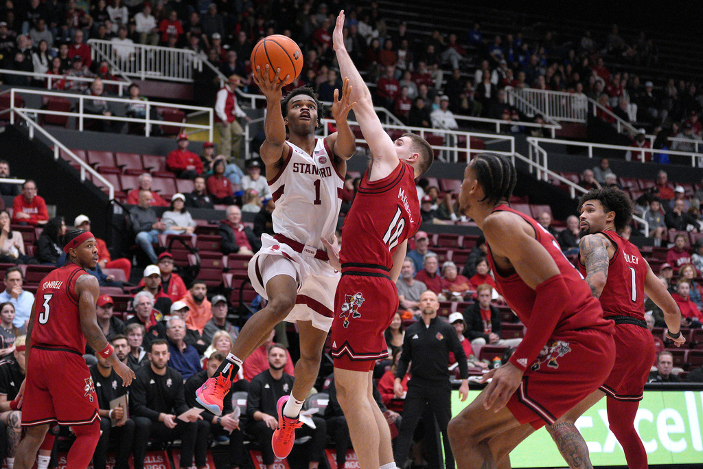 Stanford guard Ebuka Okorie (1) drives to the basket against Louisville guard Isaac McKneely (10) during the first half of an NCAA college basketball game in Stanford, Calif., Friday, Jan. 2, 2026. (AP Photo/Tony Avelar)