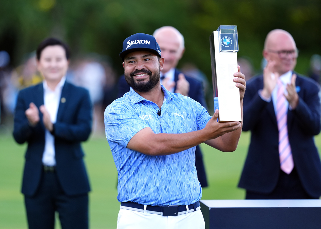 J. J. Spaun of United States lifts the trophy after winning the PGA Championship at Wentworth Golf Club in Virginia Water, England, Sunday Sept. 20, 2026. (Adam Davy/PA via AP)