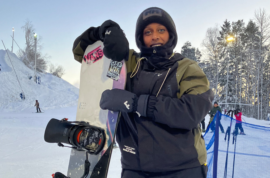 Maryan Hashi poses with her snowboard at Vedbobacken in Vasteras, Sweden, Saturday Jan. 10, 2026. (AP Photo/Steve Douglas)