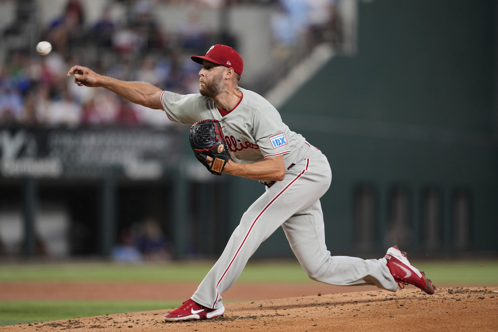 Philadelphia Phillies starting pitcher Zack Wheeler throws to the Texas Rangers in the first inning of a baseball game Sunday, Aug. 10, 2025, in Arlington, Texas. (AP Photo/Tony Gutierrez)