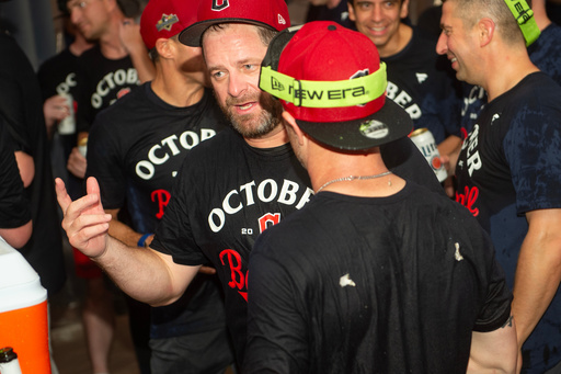 Cleveland Guardians manager Stephen Vogt, center, celebrates with his team after securing an American League playoff spot at the end of a baseball game against the Texas Rangers, Saturday, Sept. 27, 2025, in Cleveland. (AP Photo/Phil Long) Cleveland Guardians manager Stephen Vogt, center, celebrates with his team after securing an American League playoff spot at the end of a baseball game against the Texas Rangers, Saturday, Sept. 27, 2025, in Cleveland. (AP Photo/Phil Long)